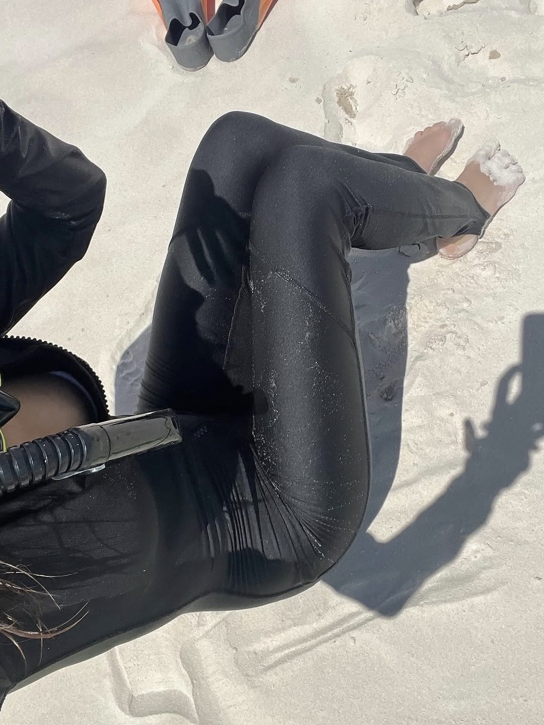 Wetsuit and dive gear on the sand