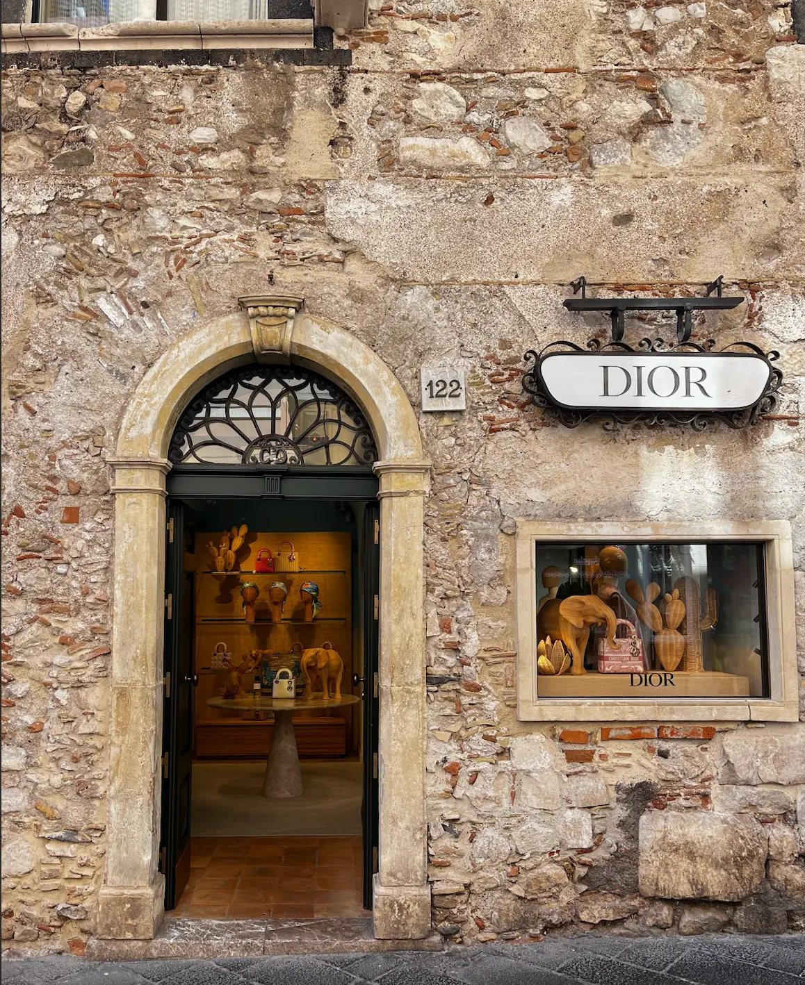 Boutique doorway on a sunlit stone street
